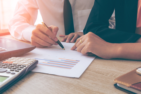 Insuring You Business - Team leaders checking paperwork
